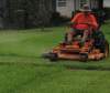 Man Mowing a St Augustine Lawn